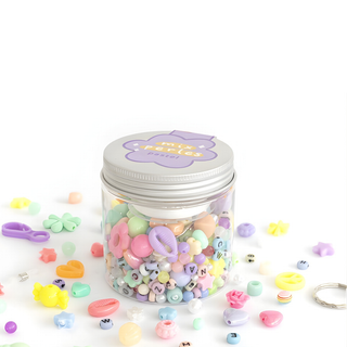 Perline artigianali per bambini nei delicati toni pastello del menta, lilla, pesca e crema; barattolo riutilizzabile per perline La Petite Épicerie per creare braccialetti dell'amicizia, dai 6 anni in su