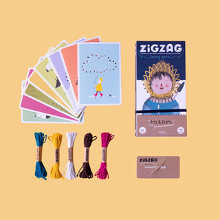 Lacing templates with coloured wool threaded through character illustrations using child-safe needles, Londji Zig Zag Lacing Game building fine motor and pre-writing skills