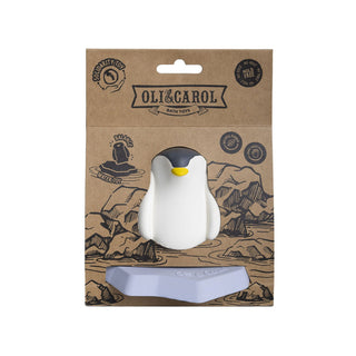 Oli & Carol penguin bath toy on iceberg in kraft packaging showing mould-free, no-hole, natural rubber and handmade badges