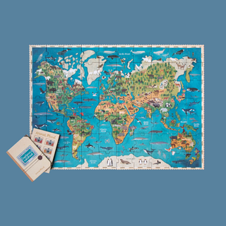 Completed 200-piece world map jigsaw showing animals across all continents, Londji Animal Planet geography puzzle with illustrated observation game for children