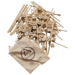 Large den kit contents showing 111 beech wood clips and connector rods laid out, 1001 Cabanes Castor pieces for multi-room forts and complex indoor constructions
