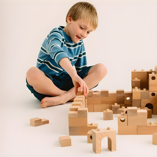 Children building tower and bridge structures with Brick A Block Builder 59 natural beech wood blocks, collaborative open-ended construction developing engineering thinking and creativity