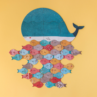 Fish and whale game pieces arranged in mandala pattern for open-ended creative play, Londji The Whale and the Fish calming sorting and stacking activity for children