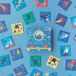 Ocean memory game cards laid out showing 16 matching sea creature pairs with octopus, fish and whale illustrations, Londji Ocean Animals concentration game for families