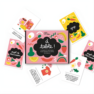 Mealtime conversation cards open showing dinner discussion starters in French, Minus Éditions À Table family set replacing screens with French conversation at the table for bilingual families