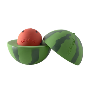 Oli & Carol watermelon stacking toy opened to reveal red rattle ball nestled inside the green striped bottom half, natural rubber baby toy