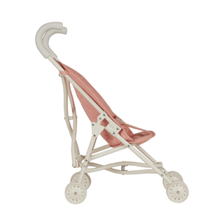 Olli Ella Sollie Stroller close-up showing handwoven rattan weave, rose pink frame and functional rolling wheels, heirloom doll pram built for durability and daily play