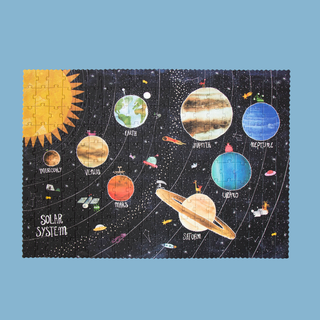 Completed 200-piece solar system jigsaw glowing in the dark showing planets from Mercury to Neptune, Londji Discover the Planets space puzzle doubling as room wall art