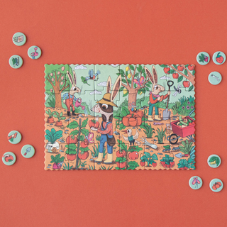 Completed 24-piece tiny garden jigsaw with observation cards showing fruits and vegetables to find, Londji Rabbit's Garden Tiny pocket puzzle for screen-free travel